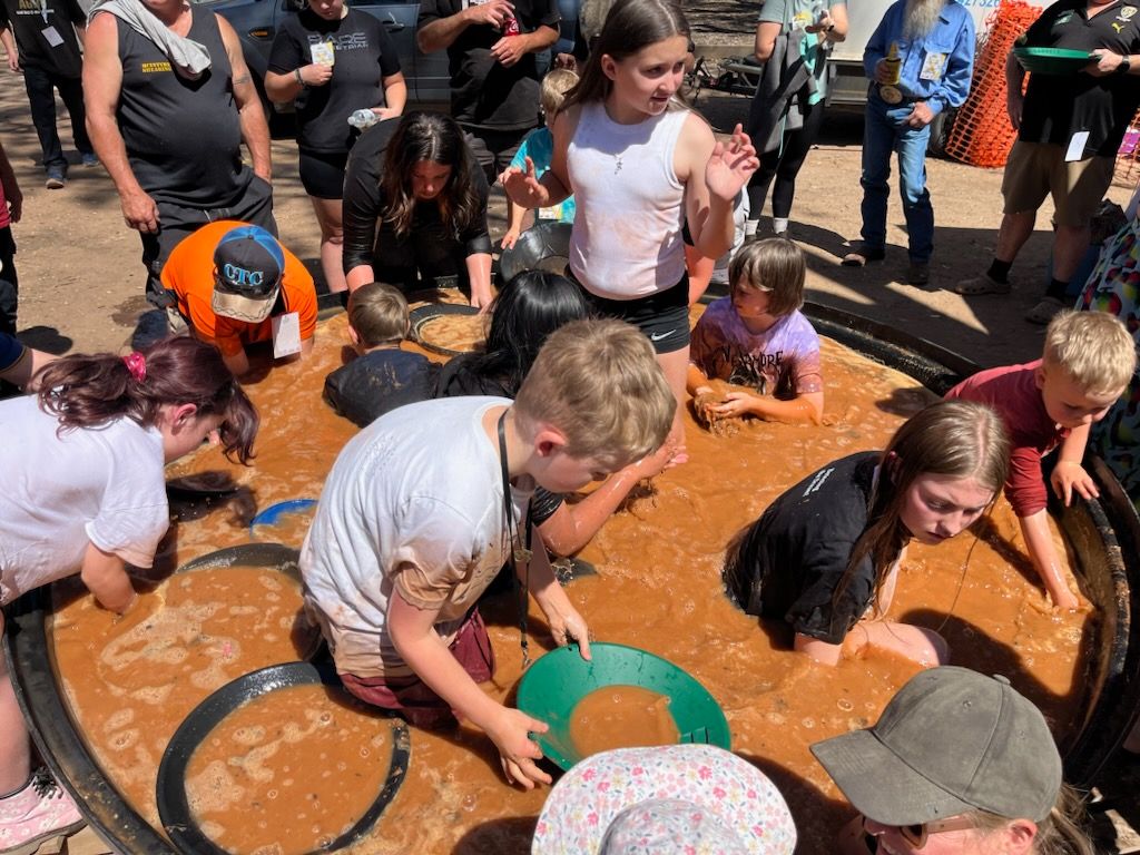 Children cooling off in the gold panning bath at the Gold Bash